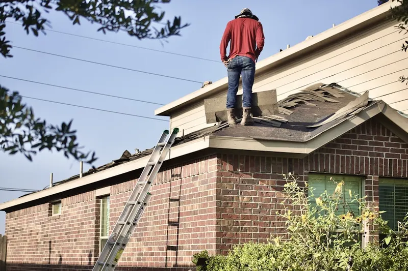 Professional roofer working on a residential roof in Eagle Ranch